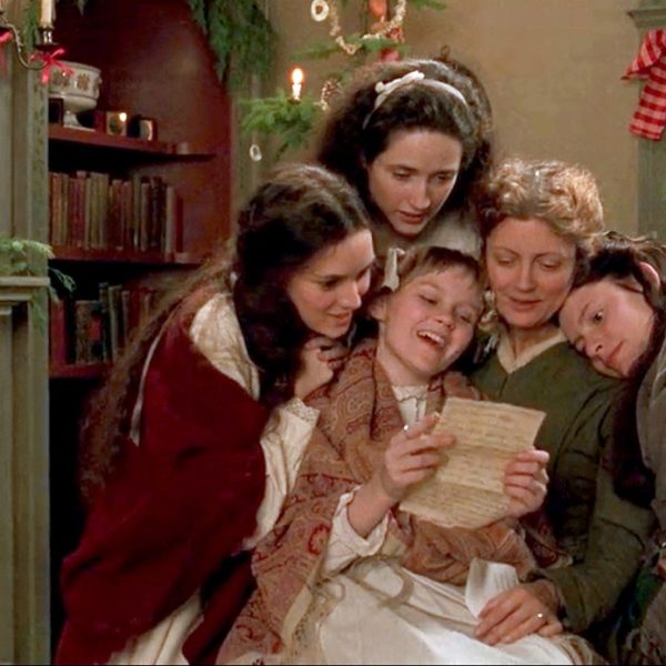 Four girls and their mother reading a letter in the tv adapation