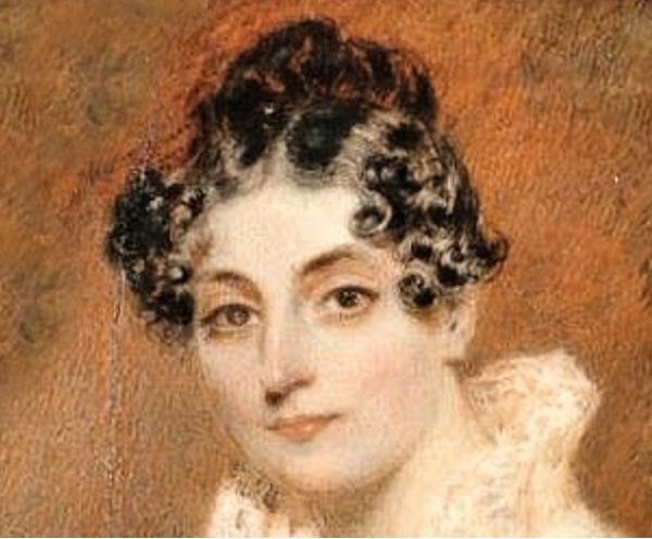 Regency woman in white dress with brown curly hair