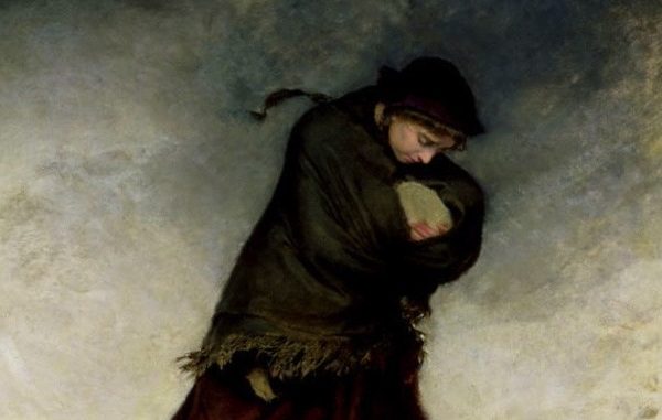 Woman carrying baby in snow