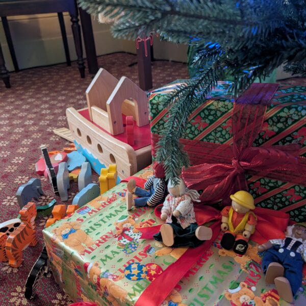 Presents under a tree with wooden toys